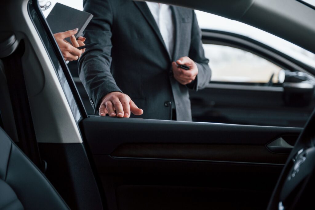 photo-from-inside-vehicle-female-customer-modern-stylish-bearded-businessman-automobile-saloon